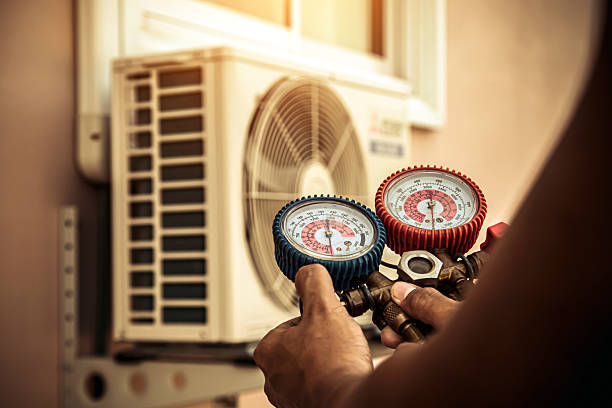 Professional Heat Pump Repair technician working in West Palm Beach, FL